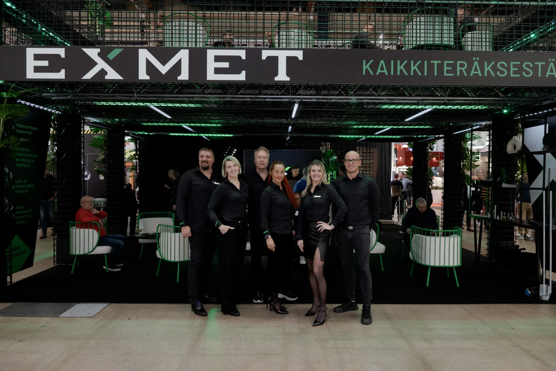 Exmet Group team in front of the stand