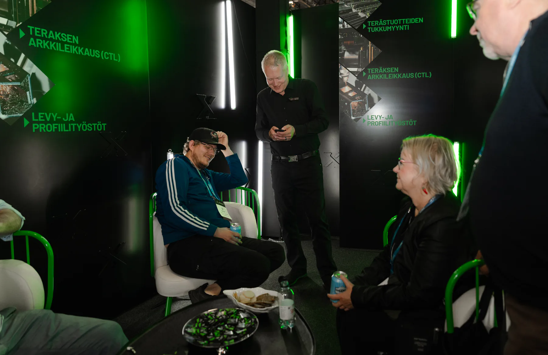 Visitors sitting and chatting in the stand lounge