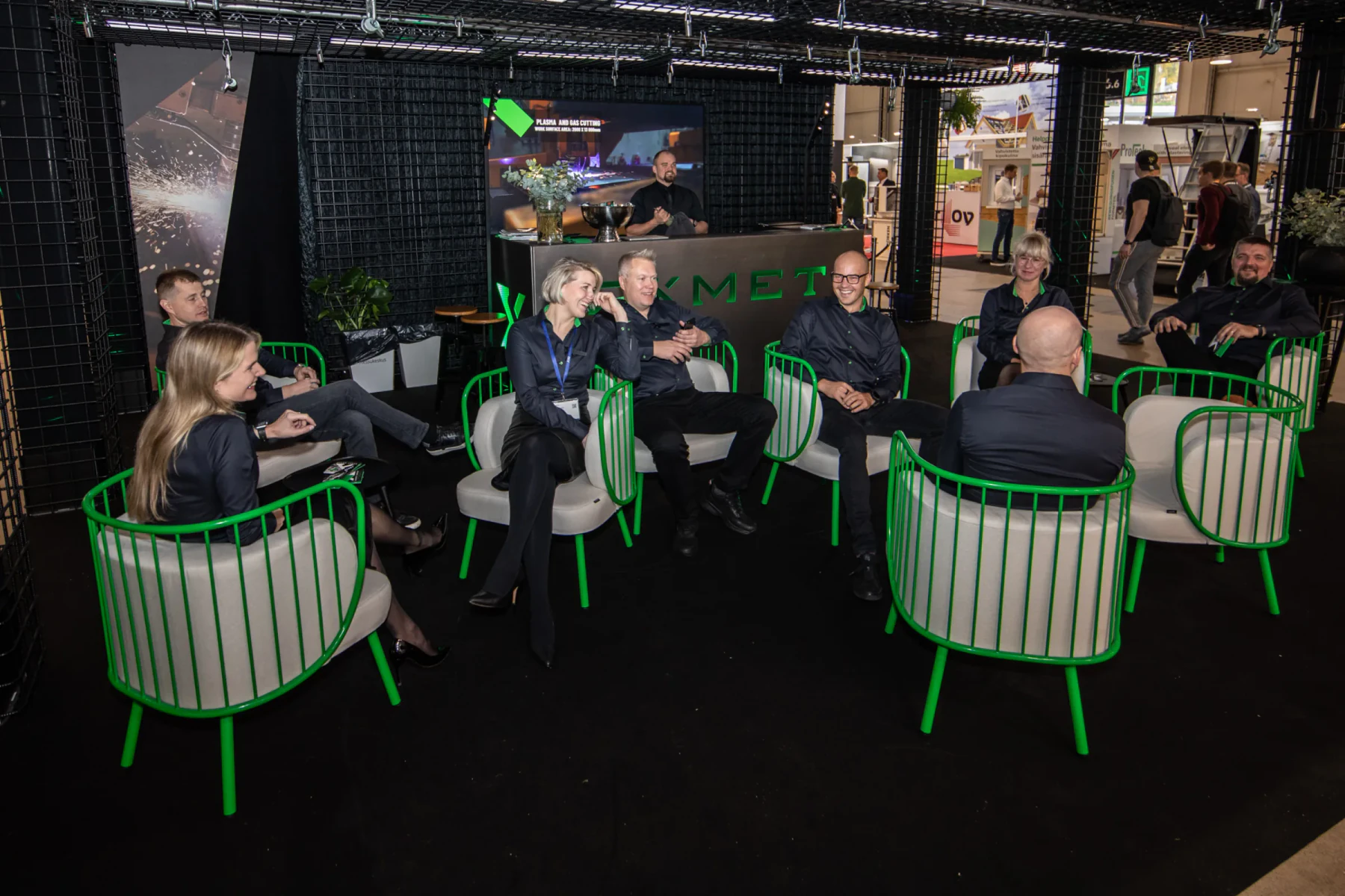 Exmet team gathered at the exhibition stand