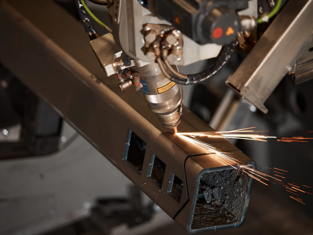 Exmet-branded steel materials arranged on a dark tray