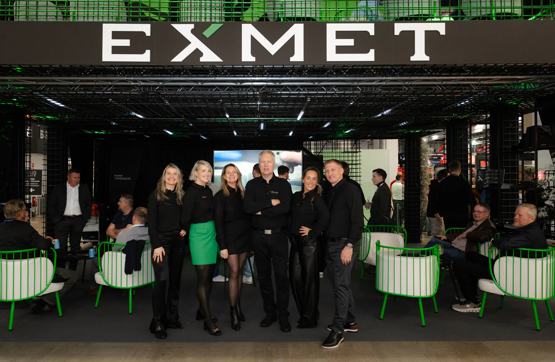 Exmet team standing together at the front of the stand