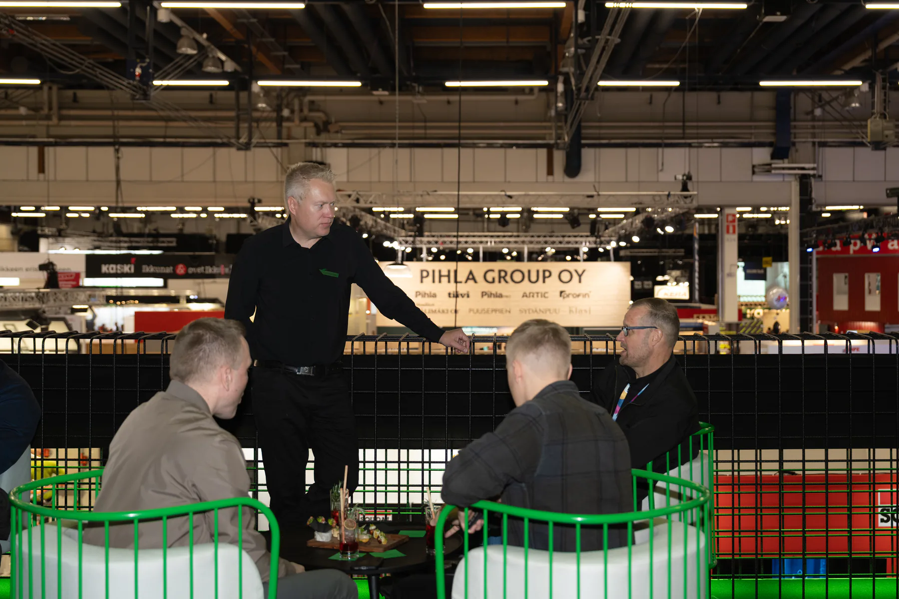 Exmet expert talking with seated visitors on the upper deck